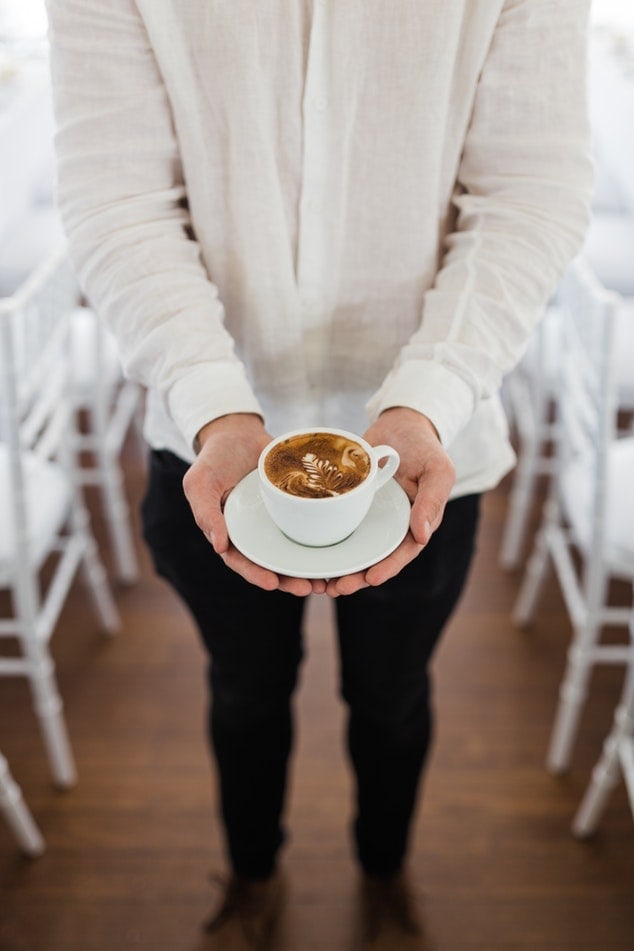 Person holding Coffee